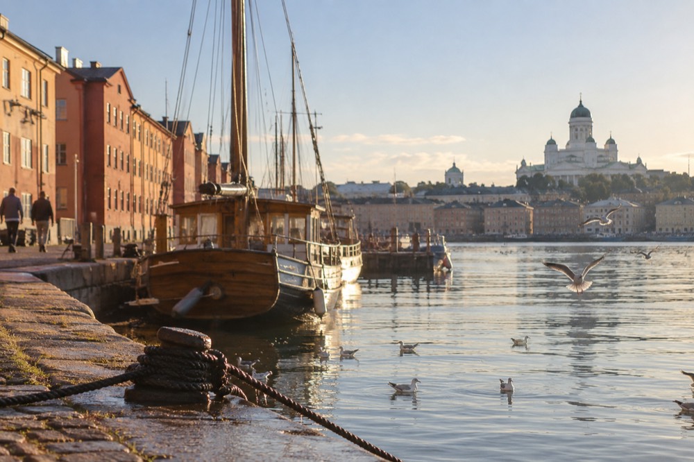 A harbour front with colourful historic buildings along the water